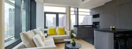 Suite living area at COMO Metropolitan Singapore with city views