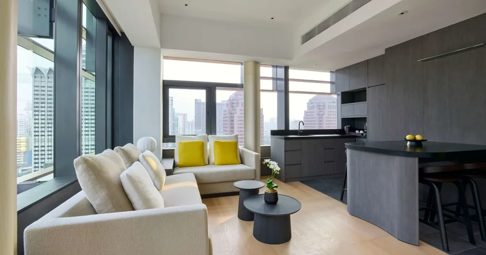 Suite living area at COMO Metropolitan Singapore with city views